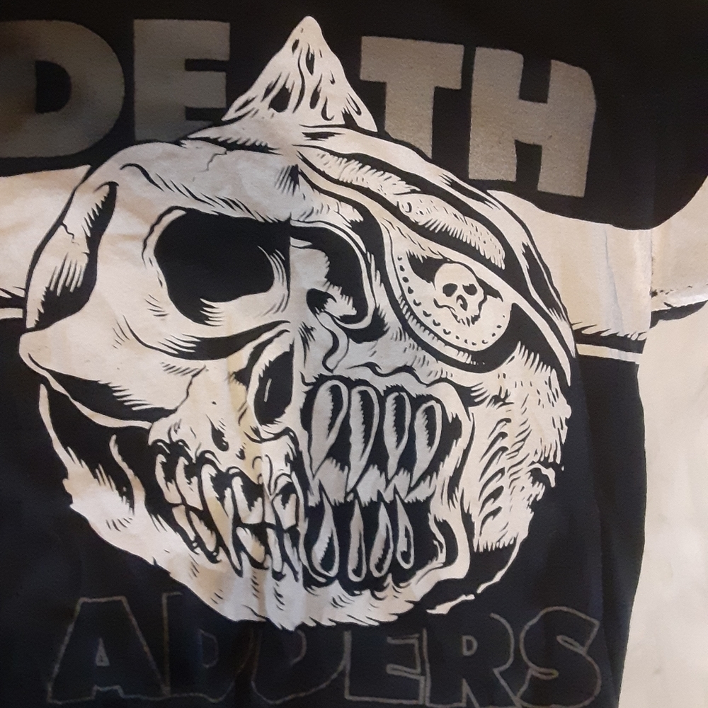 A Miskha Death Adders short sleeved shirt.